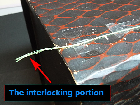 Secure the cut section to the workbench with sticky tape.